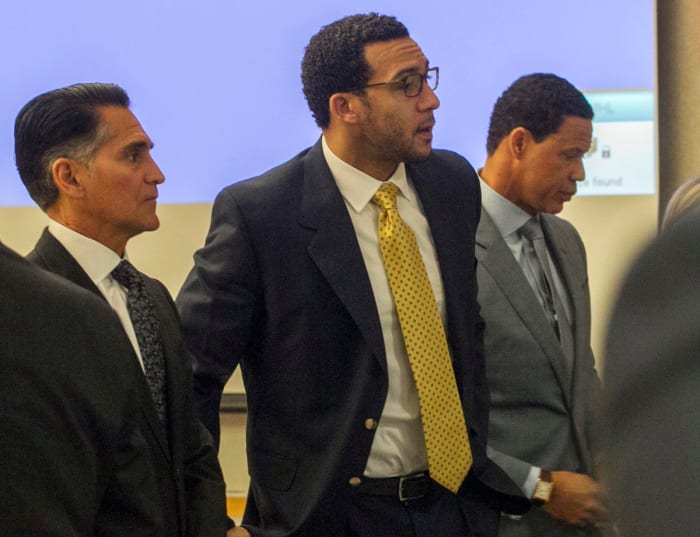 Winslow (center), flanked by trial attorneys Marc Carlos (left) and Brian Watkins (right).